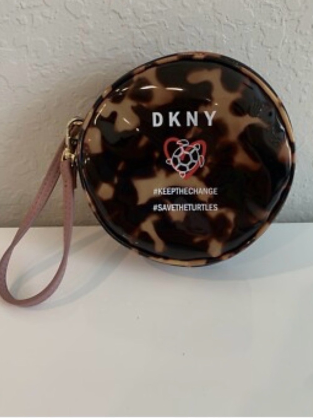 DKNY Tortoiseshell Round Wristlet with Pink Strap